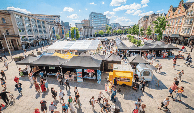 Photo of a market on Old Market Square in the sunshine